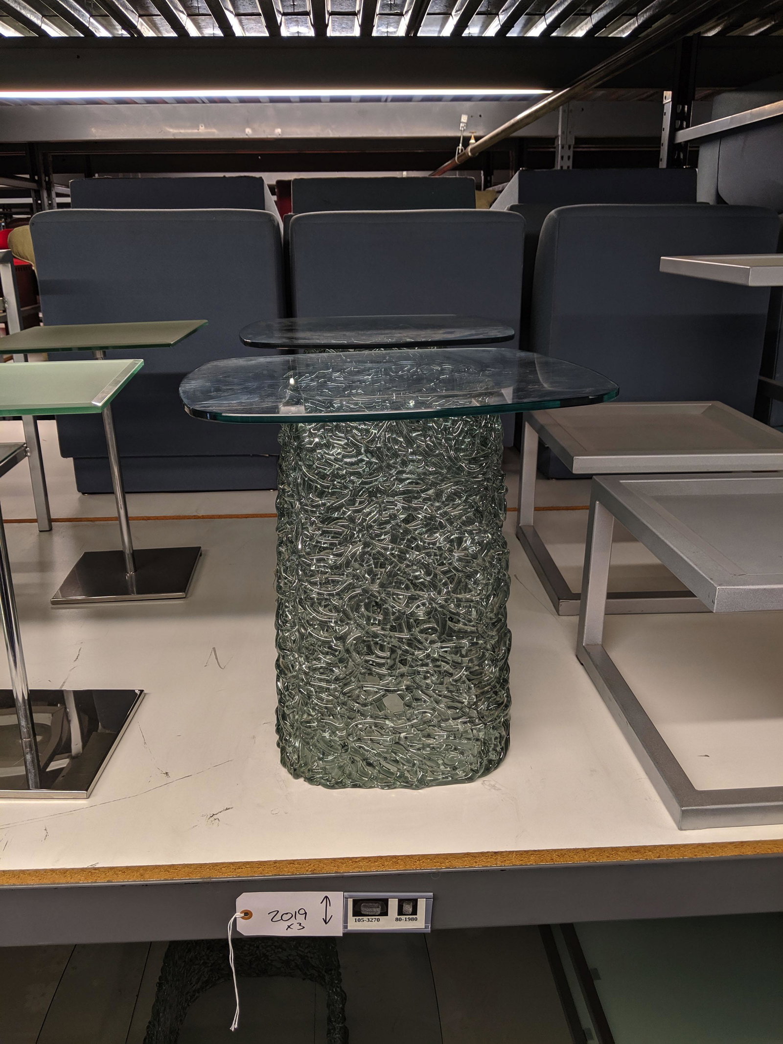 Glass Spaghetti Tables: Pair of side tables and one coffee table with squiggly glass bases.