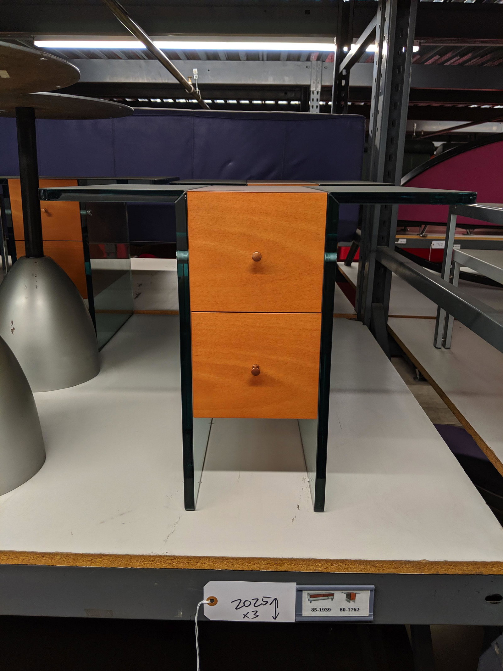 Glass-Cased Table Set: Glass-cased table set with one coffee table and two side tables.