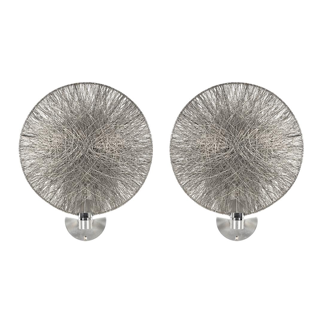 Spun Wire Sconces (2): Pair of round sconces with structure surrounded by wire to create shade and aluminum fittings, 2000s.