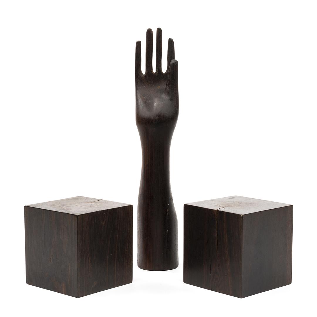 Don Shoemaker Group (3): Hand-carved cocobolo sculpture of a hand together with two rosewood blocks by Don Shoemaker, Mexico, 1970s. Property from the Estate of Evelyn and Jerome Ackerman, Los Angeles, CA.