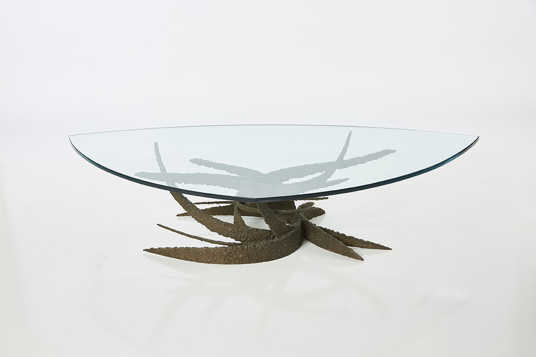 Daniel Gluck Sculptural Coffee Table: Brutalist torch-cut coffee table with triangular glass top by Daniel Gluck, ca. 1975.