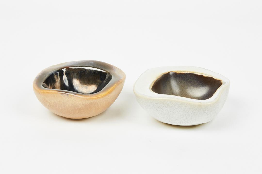 Russel Wright, Trinket Bowls (2): Russel Wright Two trinket bowls, 1940s Glazed ceramic. Produced by Bauer, USA. Underside of white bowl impressed 'Russel Wright.'