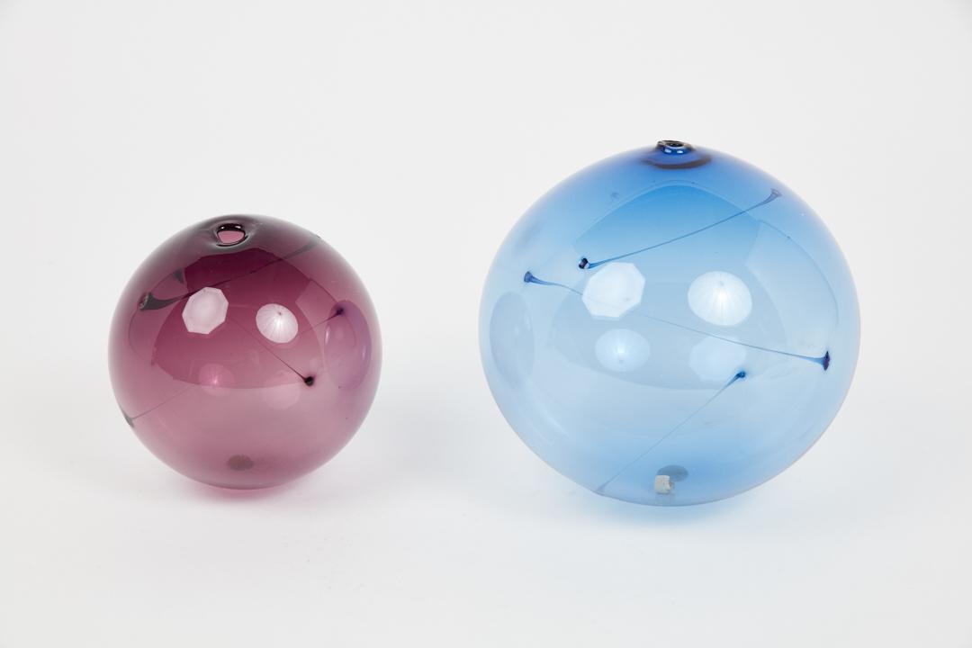Timo Sarpaneva, 'Sun Balls' (2): Timo Sarpaneva Set of two 'Sun Balls', 1970s Colored glass. Manufactured by Iittala, Finland. Smaller ball: 5.5" Dimensions: 7.5" H 7.5" W 7.5" D.
