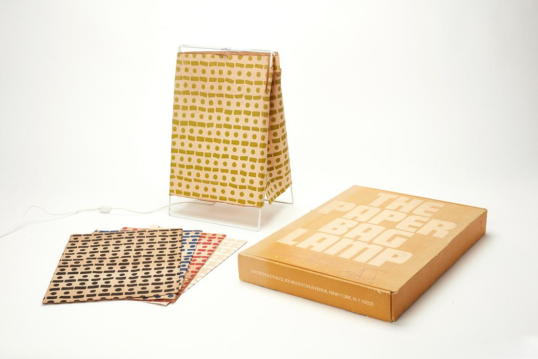 George Kovacs, 'The Paper Bag Lamp': George Kovacs 'The Paper Bag Lamp,' 1980s Printed paper, painted metal. Manufactured by George Kovacs, USA. Together with original box and selection of five paper shades. Lamp: 17.75" H x 11" W x 8" D