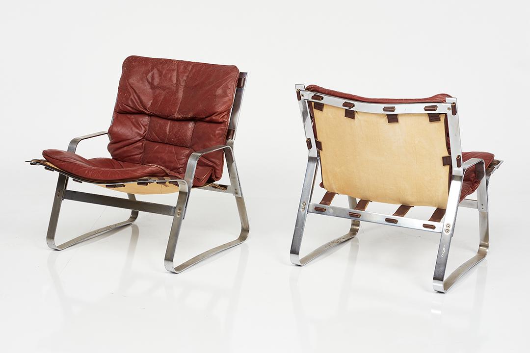 Elsa & Nordahl Solheim, Lounge Chairs (2): Elsa & Nordahl Solheim Pair of lounge chairs, 1960s Chrome-plated steel, leather, canvas. Manufactured by Rybo Rykken, Norway. Each: 28.5" H x 25" W x 28" D