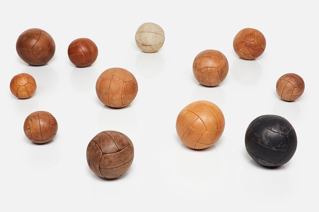 Vintage, Medicine Balls (12): Vintage Collection of 12 medicine balls, 1950s Leather. Made in France. Largest: 9" Diameter Smallest: 7.5" Diameter