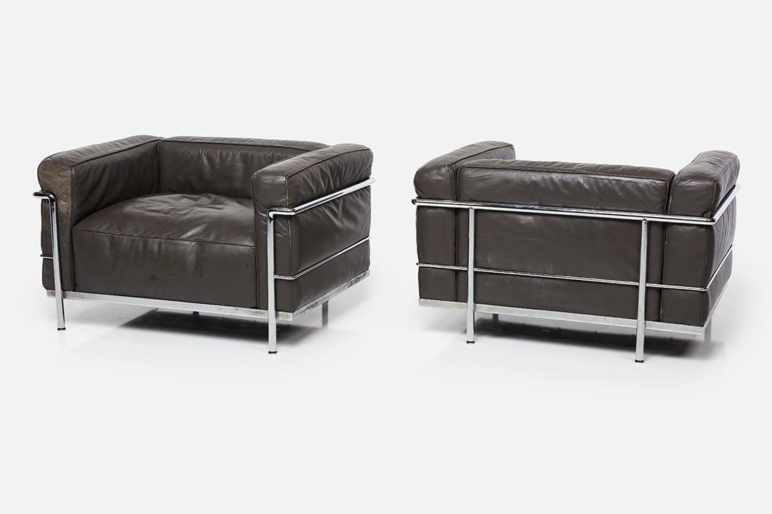 Le Corbusier, 'LC3' Lounge Chairs (2): Le Corbusier Pair of 'LC3' lounge chairs, 1970s Leather, chrome-plated steel. Manufactured by Cassina, Italy. Each chair with impressed logo, model and serial number. Each: 24" H x 39" W x 28.5" D Sea
