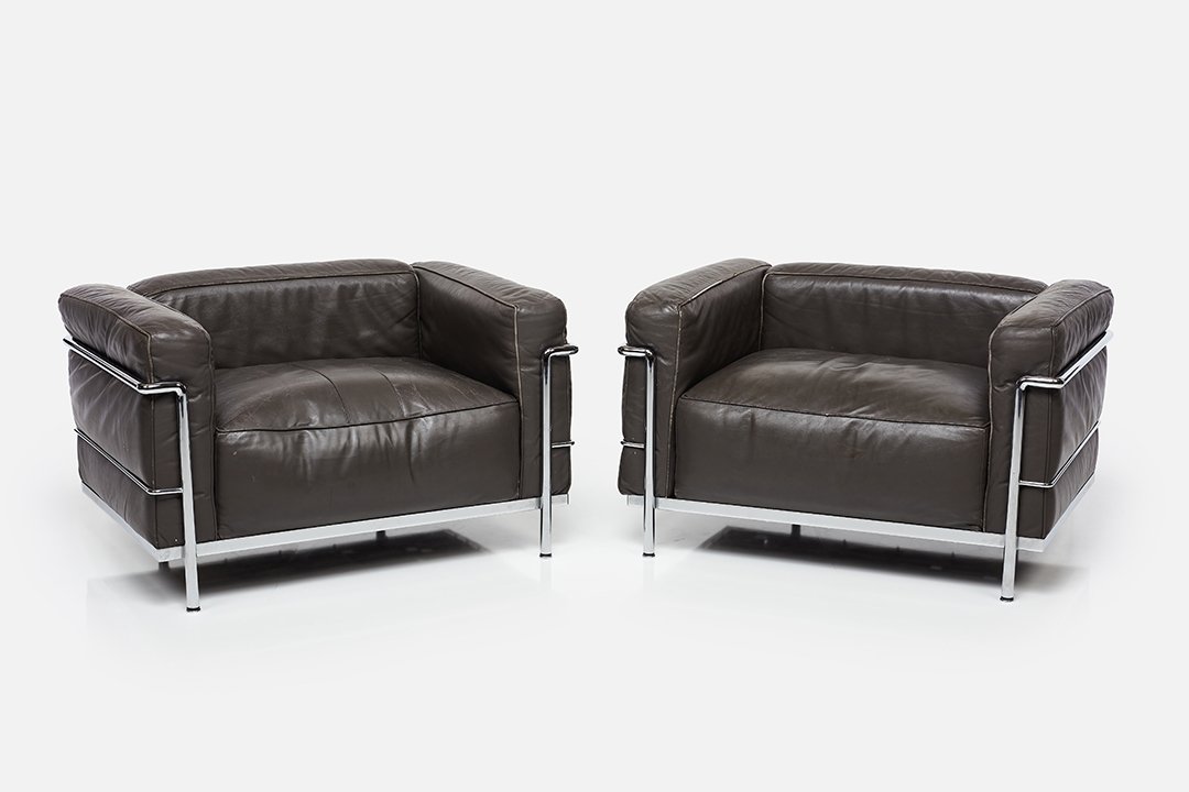 Le Corbusier, 'LC3' Lounge Chairs (2): Le Corbusier Pair of 'LC3' lounge chairs, 1970s Leather, chrome. Manufactured by Cassina, Italy. Each chair with impressed logo, model and serial number. 24" H x 39" W x 28.5" D Seat height: 15.75"