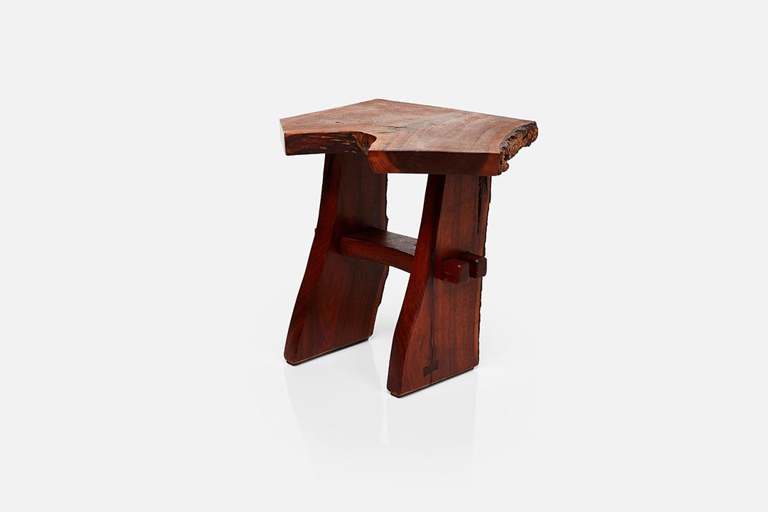 Jeffrey Greene, Live-Edge Side Table: Jeffrey Greene Live-edge side table, late 20th Century American black walnut. Studio-made in the USA. Underside incised "Jeffrey Greene." 20.75" H x 20.5" W x 20" D