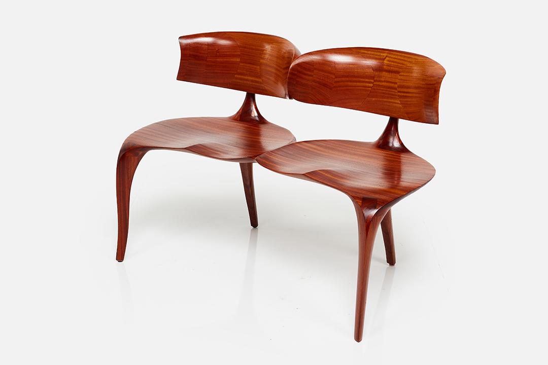 Victor DiNovi, Two-Seat Bench: Victor DiNovi Sculptural two-seat bench, 2001 Stack-laminated and carved African mahogany. Studio-made in Santa Barbara, CA. Underside signed and dated. 31" H x 44" W x 22" D Seat height: 17.75"