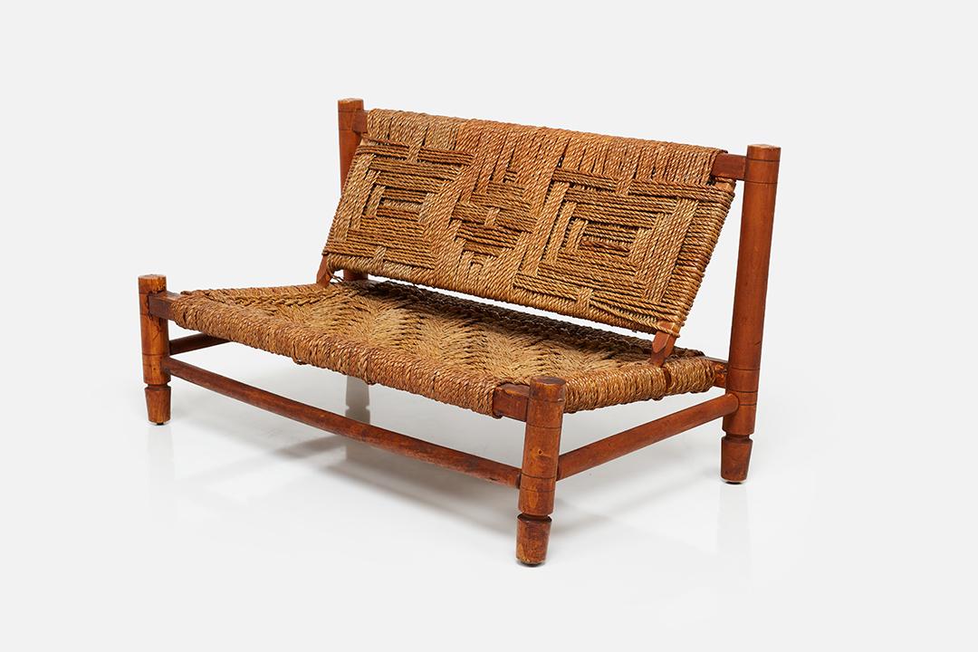 French, Armless Settee: French Armless settee, 1950s Wood, woven seagrass. 28.25" H x 50" W x 28" D Seat height: 13"