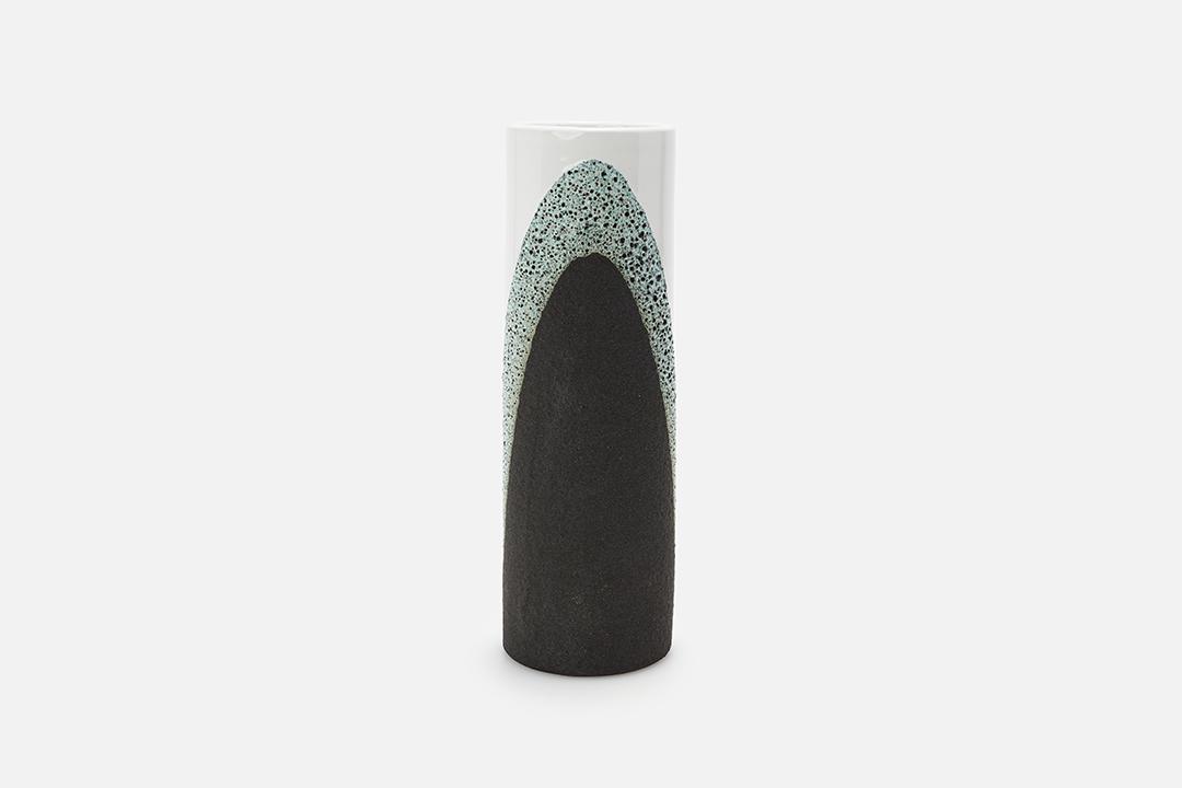 Ettore Sottsass, Lava Glaze Vase: Ettore Sottsass Lava glaze vase, 1963 Glazed ceramic. Manufactured by Bitossi, Italy for Raymor. Underside with hand-written number and "Italy" and with Raymor label. 14" H x 4.5" Diameter
