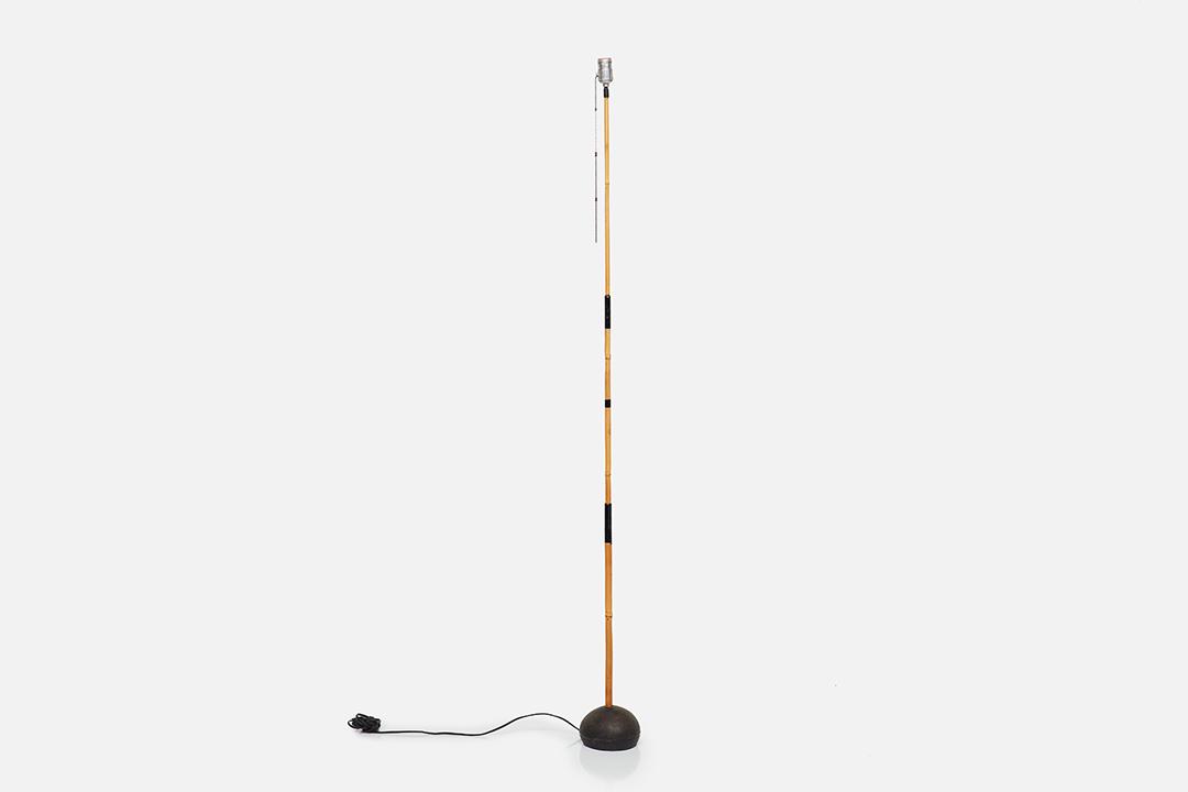 Isamu Noguchi, Early Floor Lamp Base: Isamu Noguchi Early floor lamp base, 1950s Bamboo, iron, painted metal. Manufactured by Ozeki & Co., Ltd., Japan. Underside impressed "AKARI JAPAN" and with artist's facsimile signature. 63" H x 5.5" 