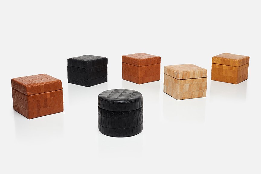 De Sede, Storage Ottomans (6): De Sede Set of six storage ottomans, 1970s Patchwork leather over wood. Manufactured by De Sede, Switzerland. Each approximately: 14" H x 16" W x 16" D