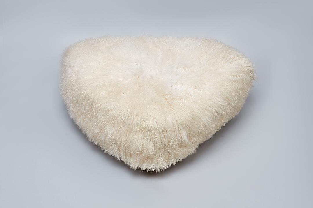 Custom, Triangular Pouf: Custom Triangular pouf, 1990s Synthetic shearling, wood. Made in Los Angeles, CA. 18" H x 40" W x 31" D