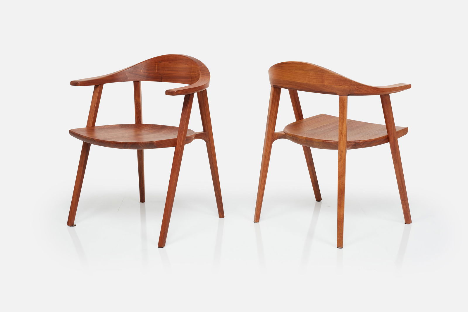 BassamFellows, 'Mantis' Armchairs (2): BASSAMFELLOWSPair of 'Mantis' armchairs, model no. CB-25, 21st CenturyWalnut. Manufactured by BassamFellows, USA.Underside branded with manufacturer's information and model number.Each: 30