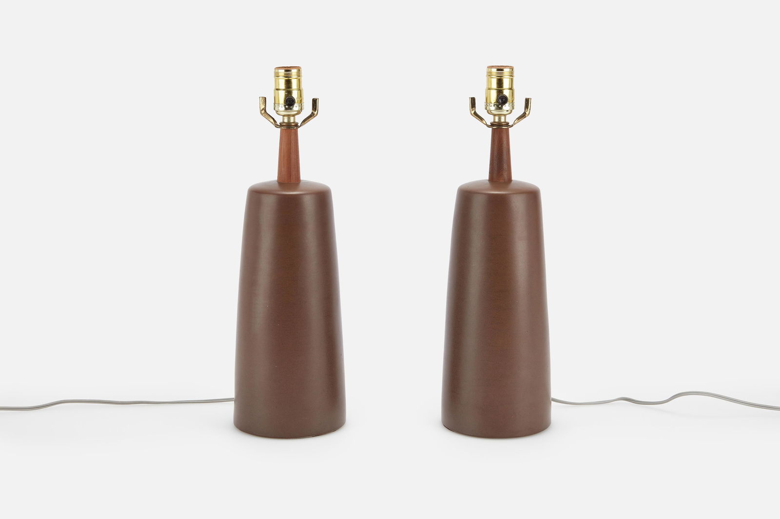 Jane + Gordon Martz, Table Lamps (2): JANE + GORDON MARTZPair of table lamps, 1960sGlazed stoneware, walnut, brass. Produced by Marshall Studios, USA.Incised signatures near cords. Each: 16.5" H x 5.25" Diameter