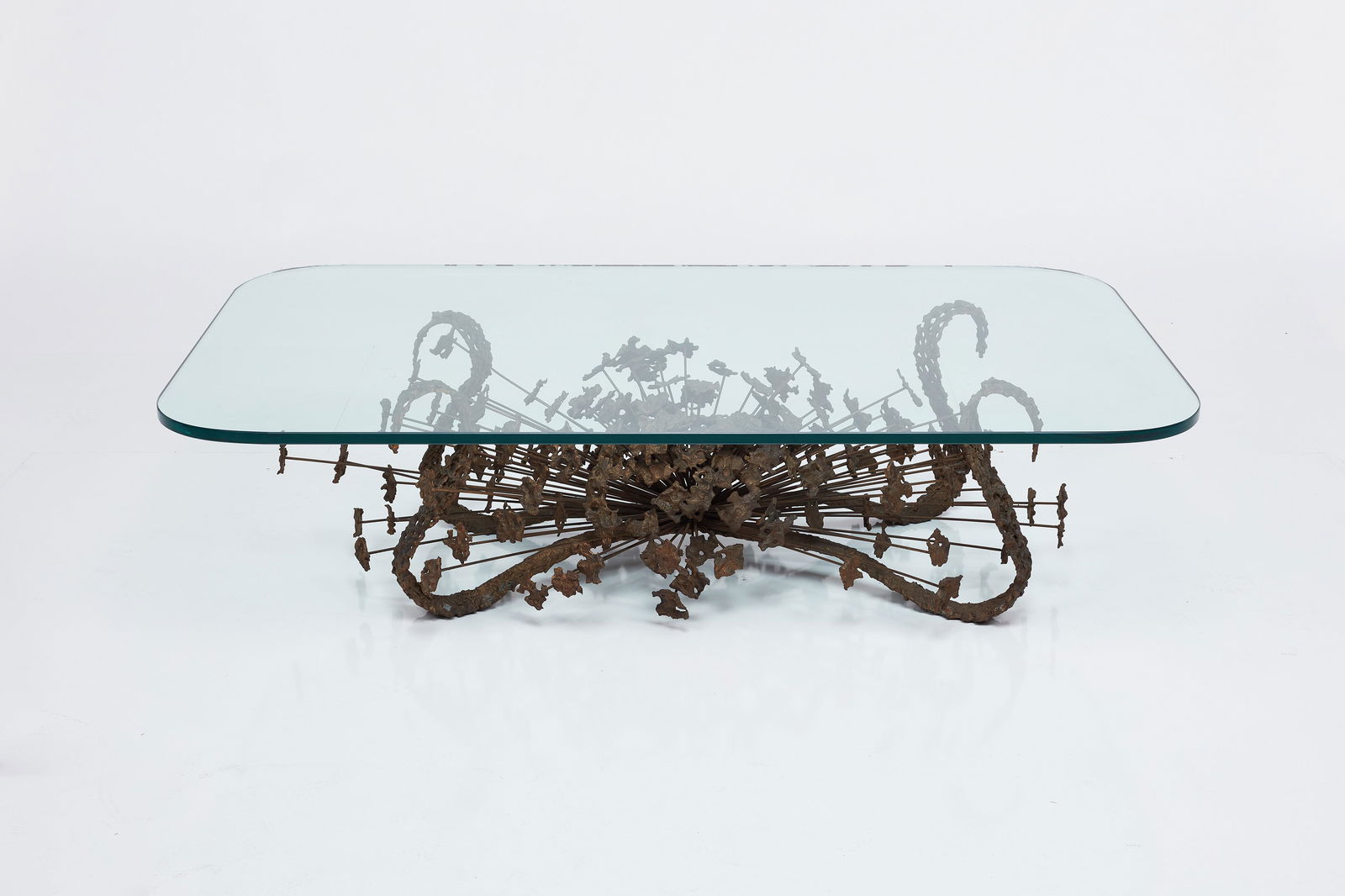 Daniel Gluck, Brutalist Coffee Table: DANIEL GLUCKBrutalist coffee table, 1970Patinated metal, glass. Produced in the USA. 15.25" H x 60" W x 36" D