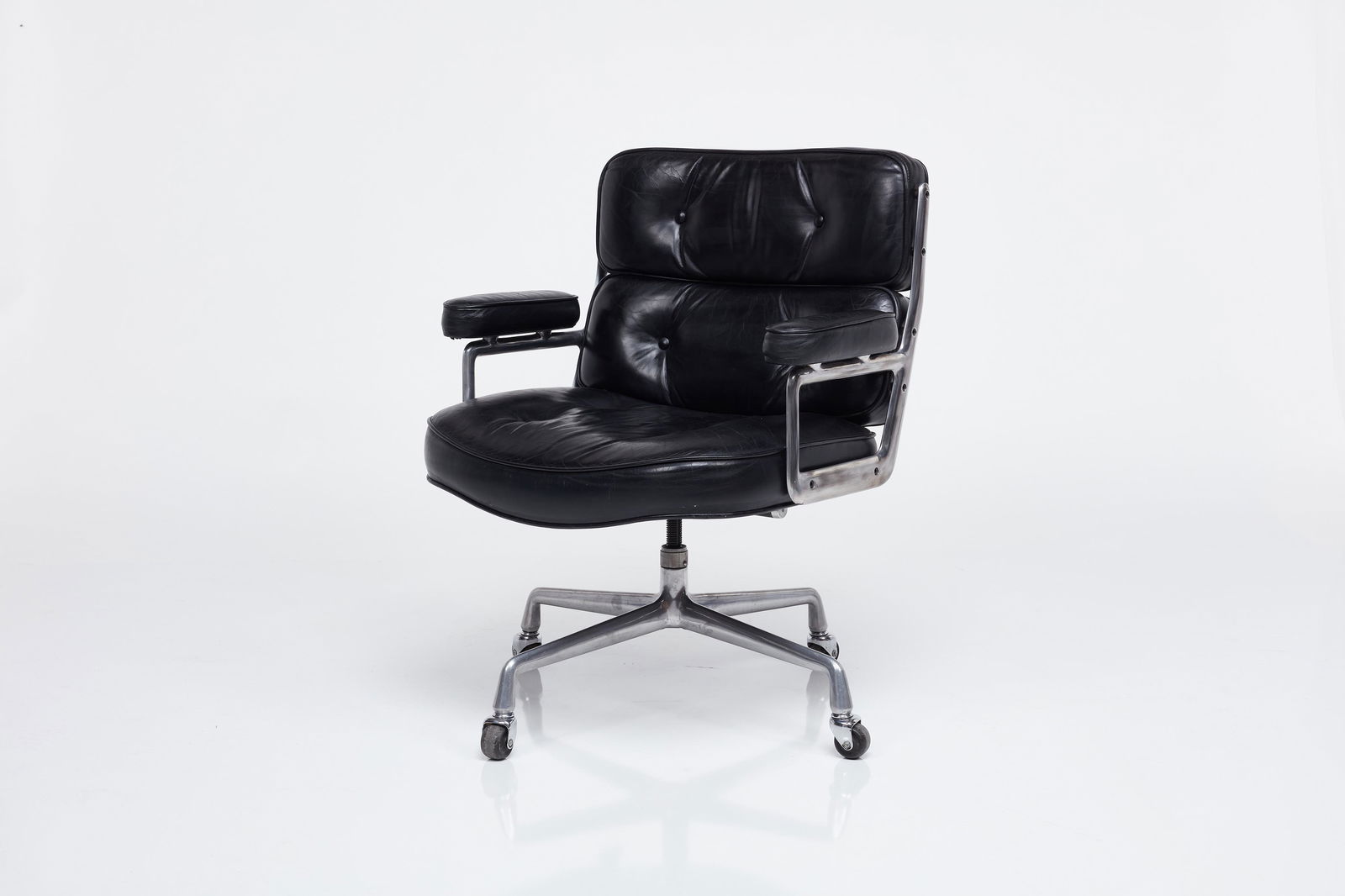 Charles + Ray Eames, 'Time Life' Executive Chair: CHARLES + RAY EAMES'Time Life' lobby chair, 1985Leather, aluminum, steel. Manufactured by Herman Miller, USA.Underside stamped "APR 29 1985." 33"- 36.25" H x 26.5