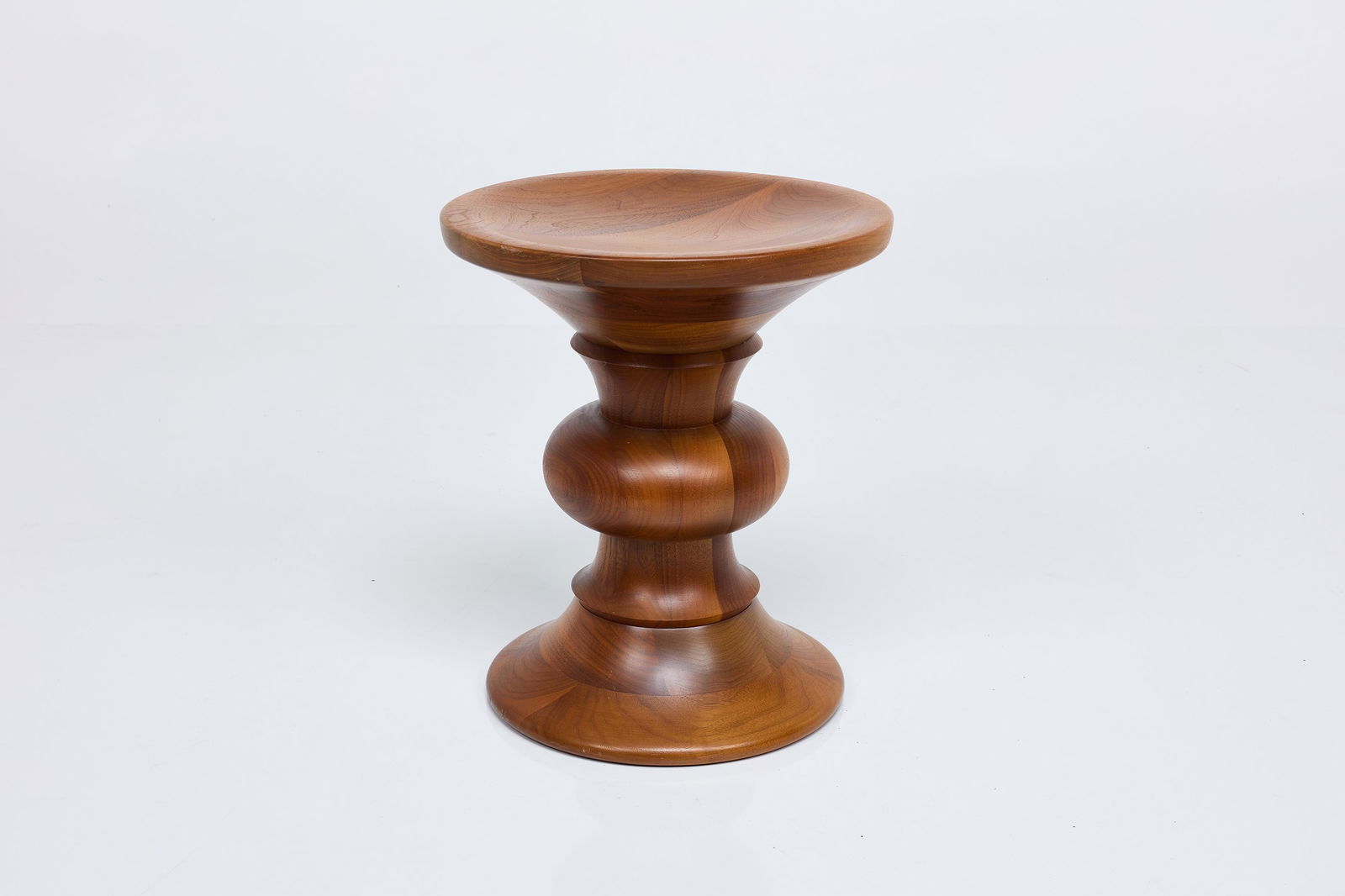 Charles + Ray Eames, 'Time Life' Stool: CHARLES + RAY EAMES'Time Life' stool, model B, designed 1960Walnut. Manufactured by Herman Miller, USA. 15" H x 13" Diameter