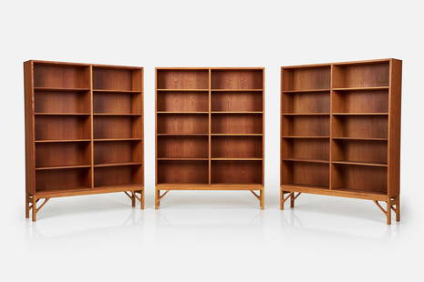 Borge Mogensen, Raised Bookcases (3): BORGE MOGENSEN Set of three raised bookcases, 1960s Teak, oak. Manufactured by FDB Mobelfabrik, Denmark. Two examples with manufacturer's stamps to the reverse.Each: 62.5" H x 48" W x