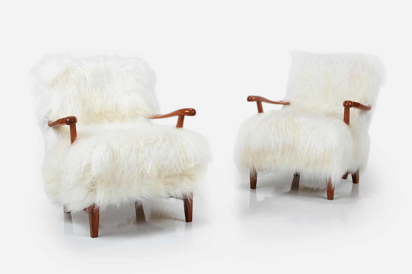 Elias Svedberg, Lounge Chairs (2): ELIAS SVEDBERGPair of lounge chairs, 1939Long pile wool, wood. Produced by Sparreholms Snickerifabrik for the HSB headquarters, Stockholm, Sweden.Each leg with metal plaque stamped "HSB