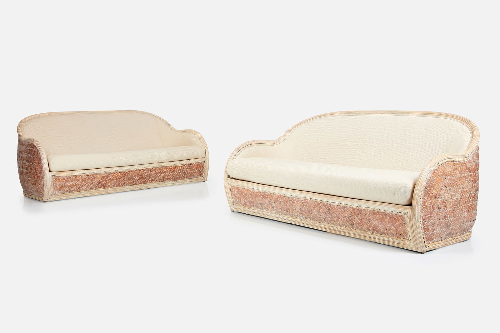 Modernist, Rattan Settees (2): MODERNISTPair of settees, 1980sWoven rattan, fabric. Each: 33.5" H x 76" W x 36" DSeat height: 16.5" 