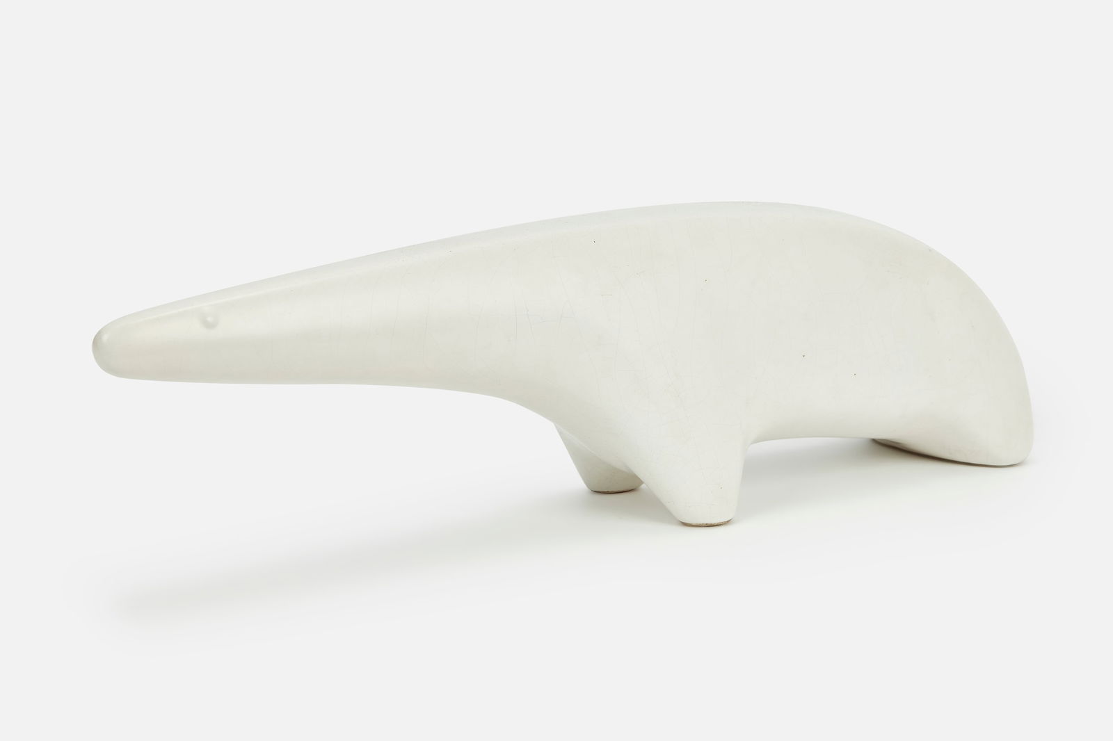 Gordon Newell, 'Polar Bear' Sculpture: GORDON NEWELL'Polar Bear' sculpture, model no. N-1, 1950sGlazed earthenware. Manufactured by Architectural Pottery, USA. 7.5" H x 26.5" W x 6.25" D