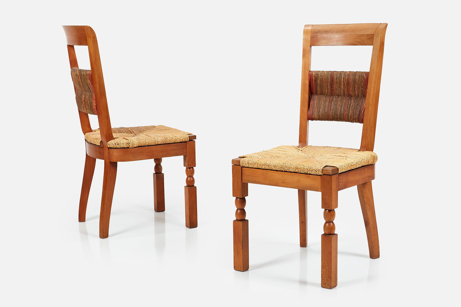 Andre Arbus, Hall Chairs (2): ANDRE ARBUS (Attrib.)Pair of hall chairs, 1940sOak, rush, dyed rush. Made in France. Each: 38” H x 18” W x 19” DSeat height: 18”