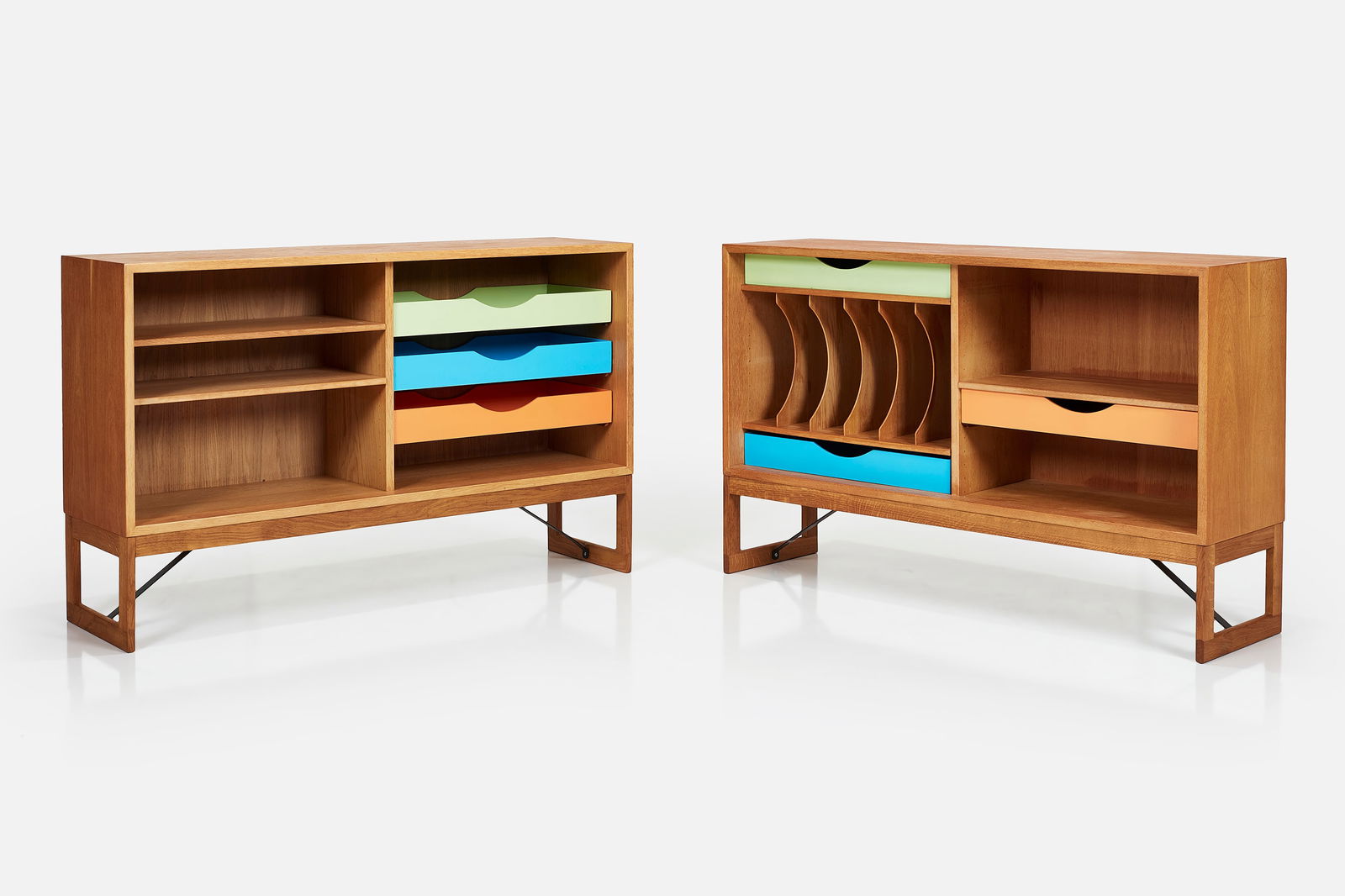 Borge Mogensen, Cabinets (2): BORGE MOGENSENPair of cabinets, ca. 1955Teak, oak, lacquered wood, enameled steel. Manufactured by Karl Andersson & Soner, Denmark / Sweden.One example with manufacturer's sticker. 