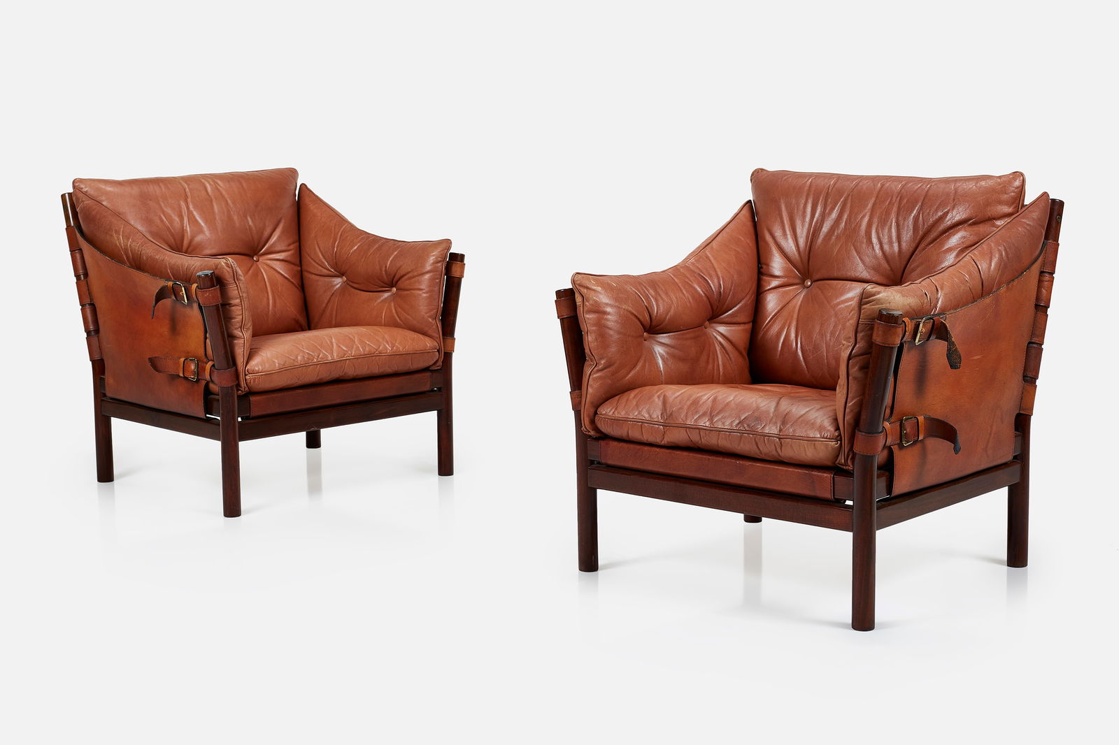 Arne Norell, 'Ilona' Lounge Chairs (2): ARNE NORELLPair of 'Ilona' lounge chairs, ca. 1971Leather, rosewood, fabric, brass. Manufactured by Norrel Mobel AB, Sweden. Each: 31” H x 33” W x 32” DSeat height: 16