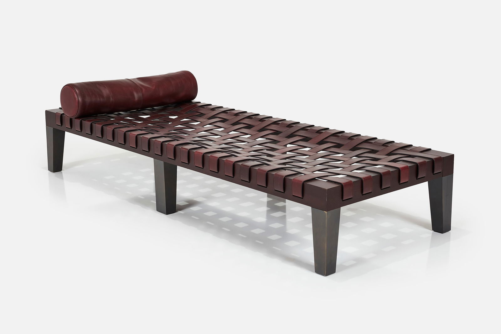 Gucci, Daybed: GUCCI Daybed, 2020s Stained wood, leather. Manufactured by Gucci, Italy. Embossed manufacturer's mark to one leather strap. 18.5" H x 74.75" W x 28" D