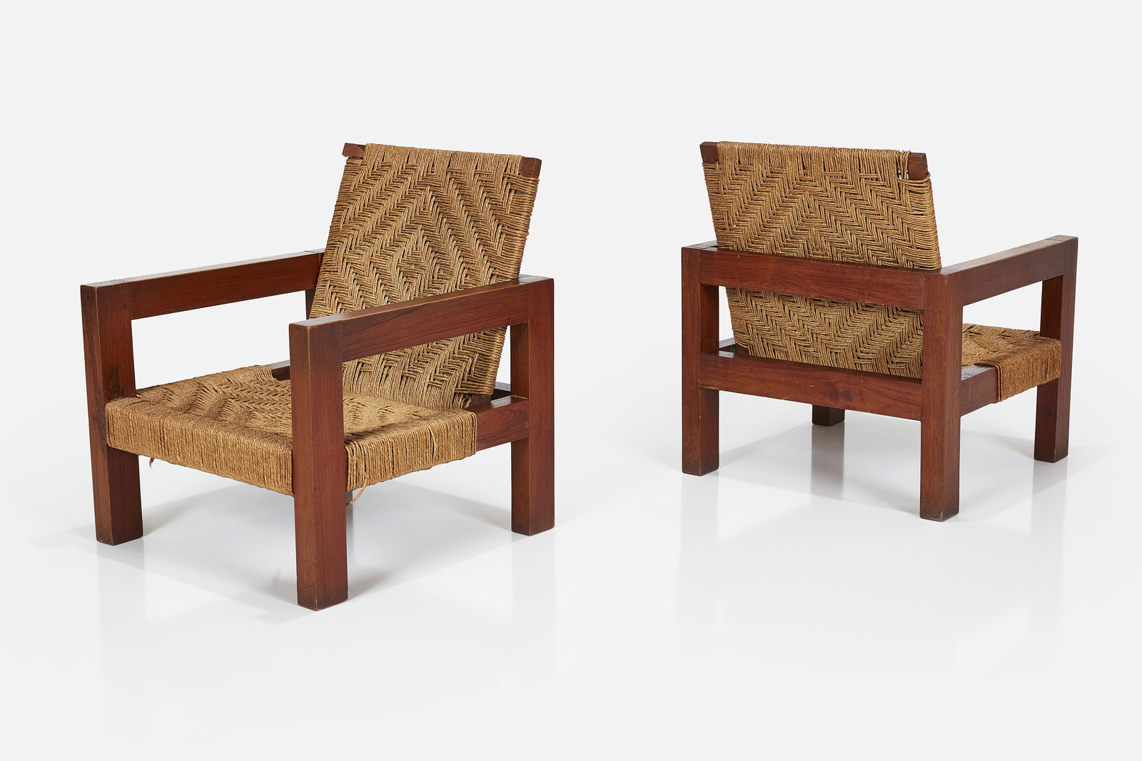 Mini Boga, Lounge Chairs (2): MINI BOGA Pair of lounge chairs, 1960s Teak, woven rope. Produced by Taaru, India. Each: 29" H x 25.25" W x 25" D Seat height: 11.5"
