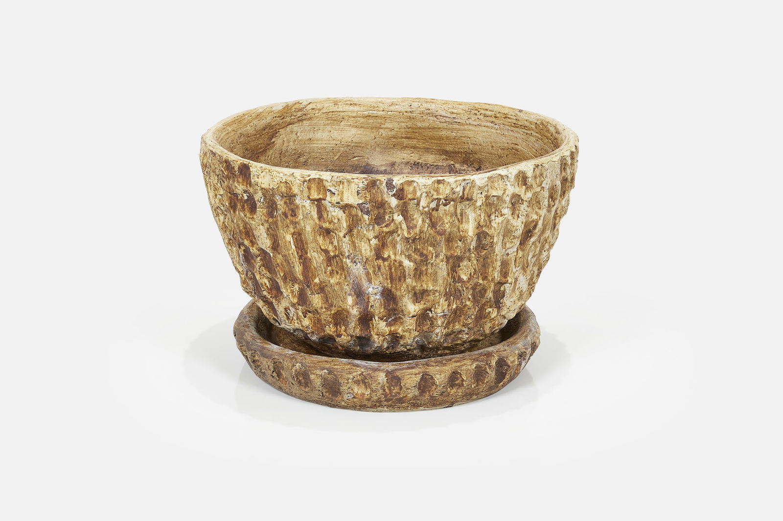 Stan Bitters, 'Thumb' Planter + Saucer (2): STAN BITTERS'Thumb' planter with saucerIron-stained stoneware. Produced by Hans Stumpf Co., USA.Interior of pot incised "A-18 Hans S Co" and saucer incised "18". 12&