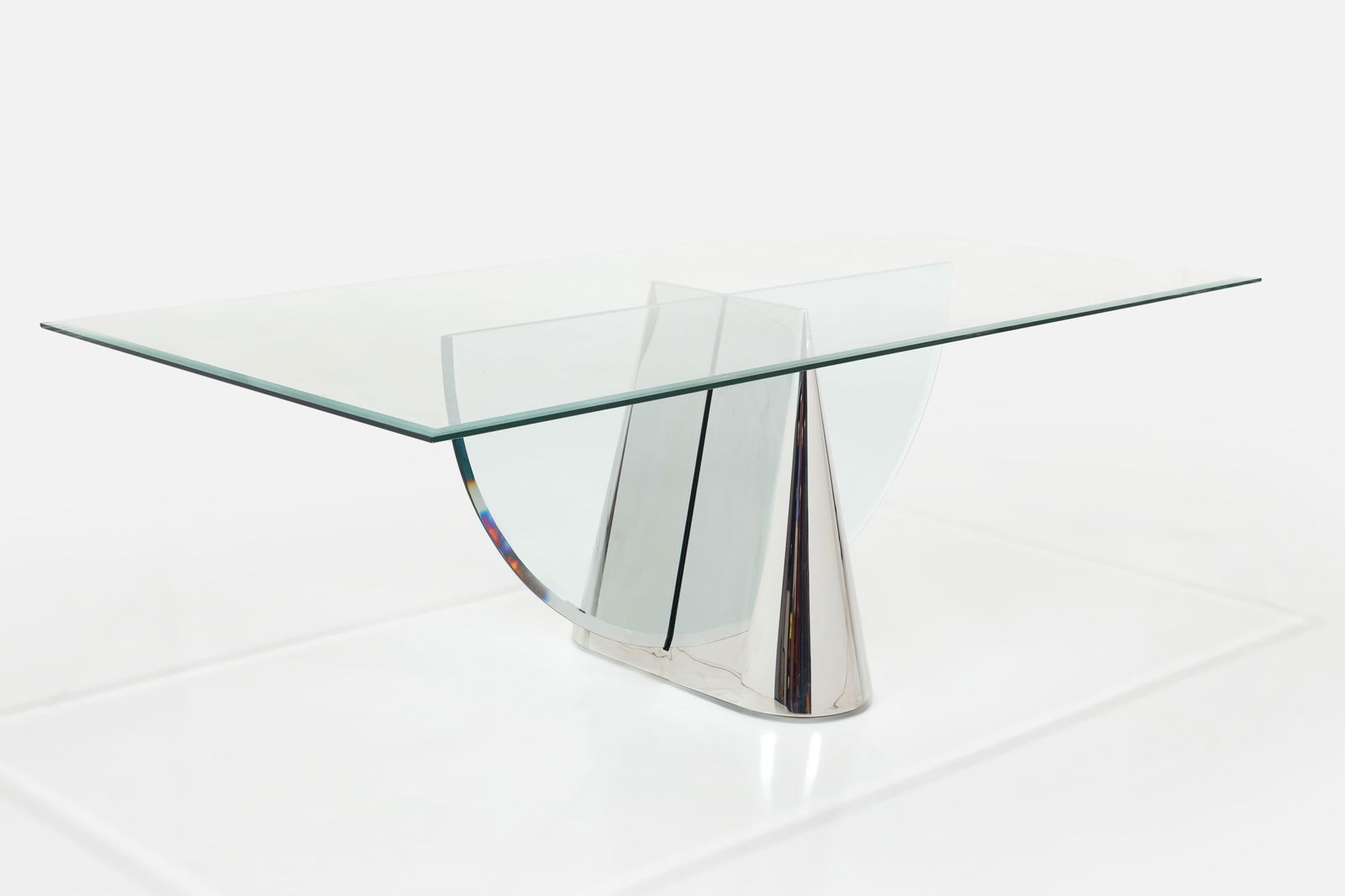 Stanley Jay Friedman, Dining Table: STANLEY JAY FRIEDMANDining table, ca. 1980Glass, polished stainless steel. Manufactured by Brueton, USA. 29" H x 84" W x 42" D