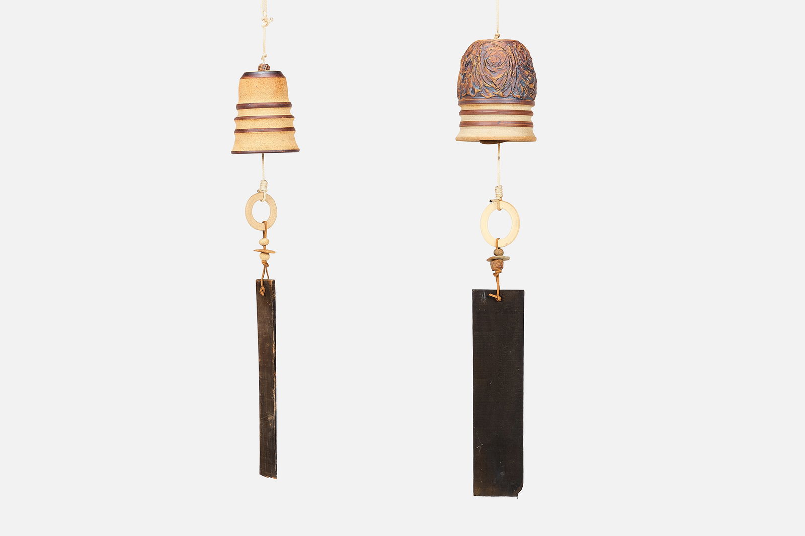 Victoria Littlejohn, Wind Bells (2): VICTORIA LITTLEJOHNTwo wind bells, 1970sGlazed ceramic, wood, leather. Studio-made, Los Angeles.Each incised "Littlejohn" to the top. 33.5" H x 6" Diameter30.5" H x 5&q