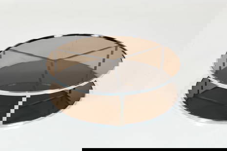 Rodolfo Dordoni, 'Huber' Coffee Table: RODOLFO DORDONI'Huber' coffee table, ca. 2007Chrome-plated steel, smoked glass. Manufactured by Minotti, Italy.Interior of base with manufacturer's decal. 13" H x 47.5" Di