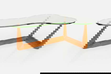 T.H. Robsjohn-Gibbings, Biomorphic Coffee Table: T.H. ROBSJOHN-GIBBINGSBiomorphic coffee table, ca. 1952Glass, bleached mahogany. Manufactured by Widdicomb, USA.Underside of base with manufacturer's brass plaque. 17" H x 50&quo