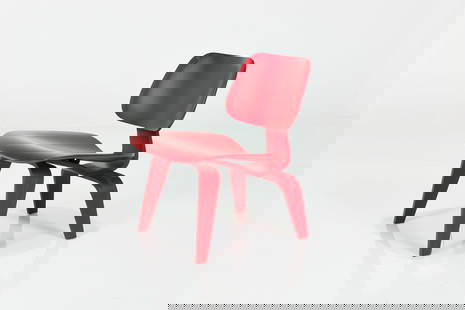 Charles + Ray Eames, LCW Chair: CHARLES + RAY EAMESLCW chair, 2003Red-stained molded plywood. Manufactured by Herman Miller, USA.Underside with manufacturer&#39;s label. &nbsp; 26.5&quot; H x 21.75&quot; W x 25&quot; DSeat height: 1