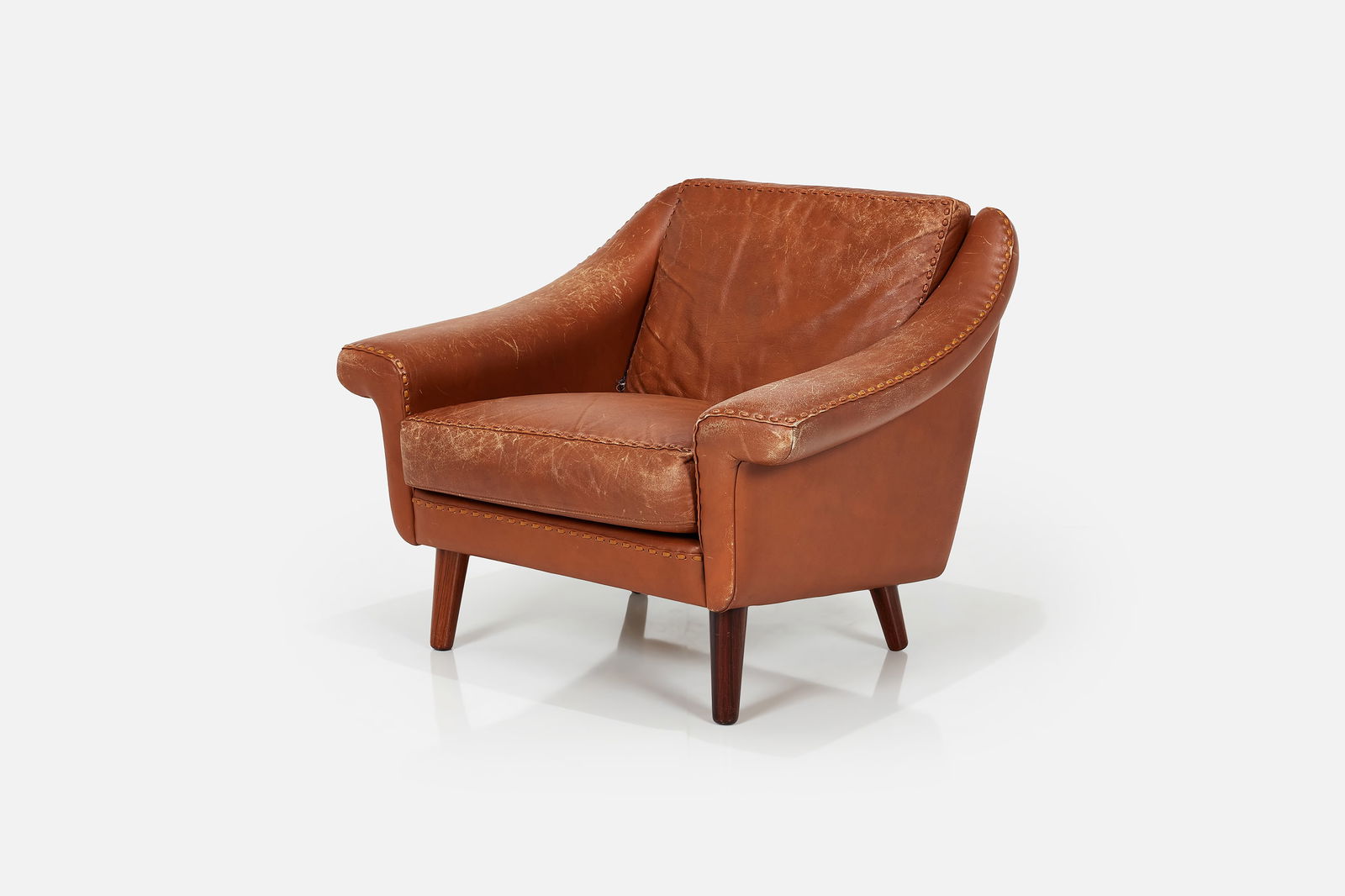 Aage Christiansen, 'Matador' Lounge Chair: AAGE CHRISTIANSEN'Matador' lounge chair, 1960sTop-stitched leather, rosewood. Manufactured by Erhardsen & Andersen, Denmark. 29" H x 35" W x 30" DSeat height: 17