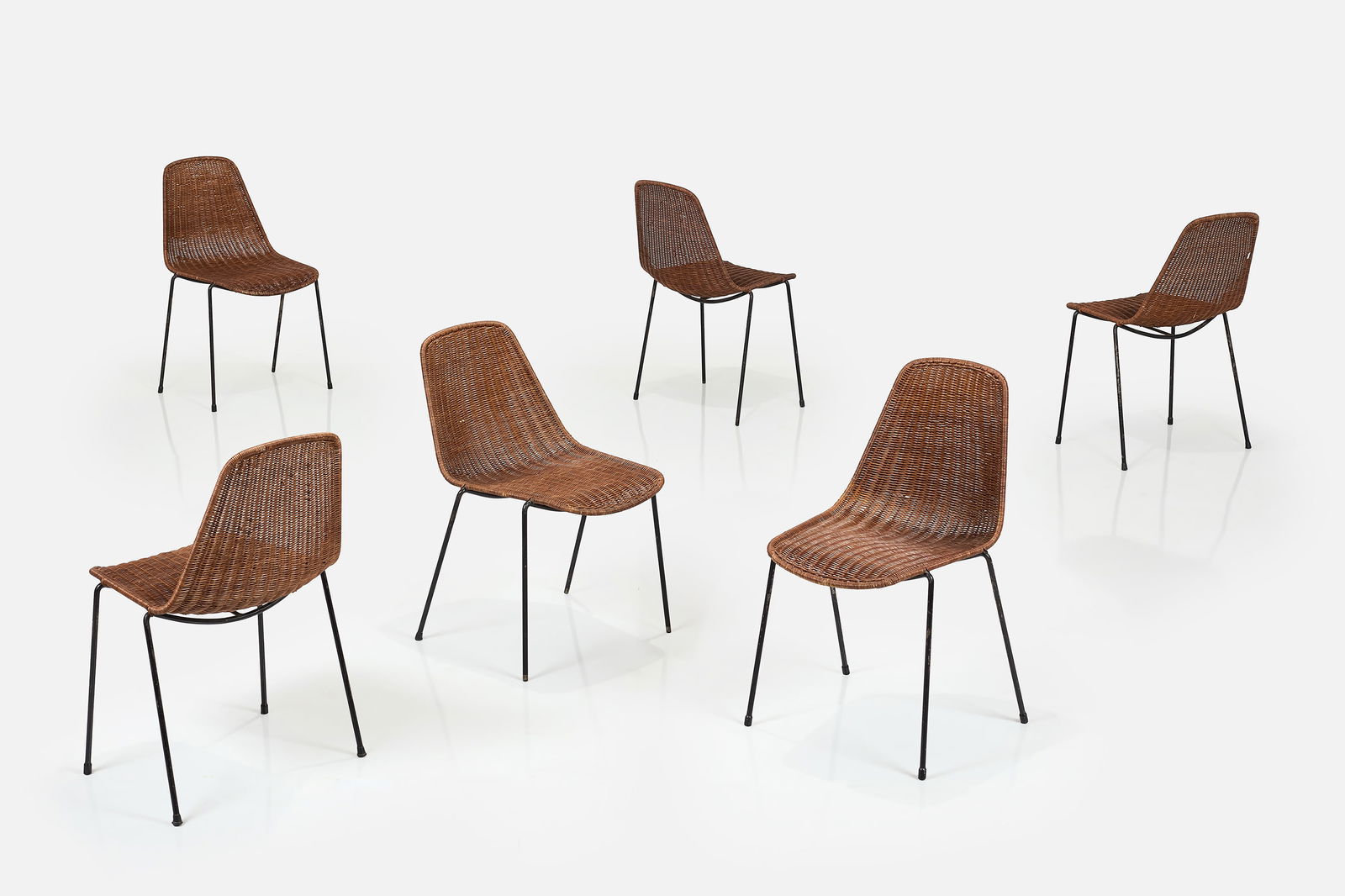 Franco Campo + Carlo Graffi, Stacking Chairs (6): FRANCO CAMPO + CARLO GRAFFISet of six stacking chairs, 1950sWicker, lacquered steel rod. Made in Italy. Each: 30" H x 18.25" W x 18" DSeat height: 18"