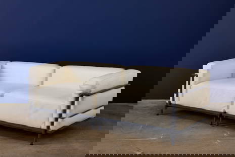 Le Corbusier, Two-Part LC3 Sofa: LE CORBUSIERTwo-part LC3 sofa, ca. 2015Leather, enameled steel. Manufactured by Cassina, Italy.Underside of cushions with manufacturer's branded decking and label; underside of right-facing a