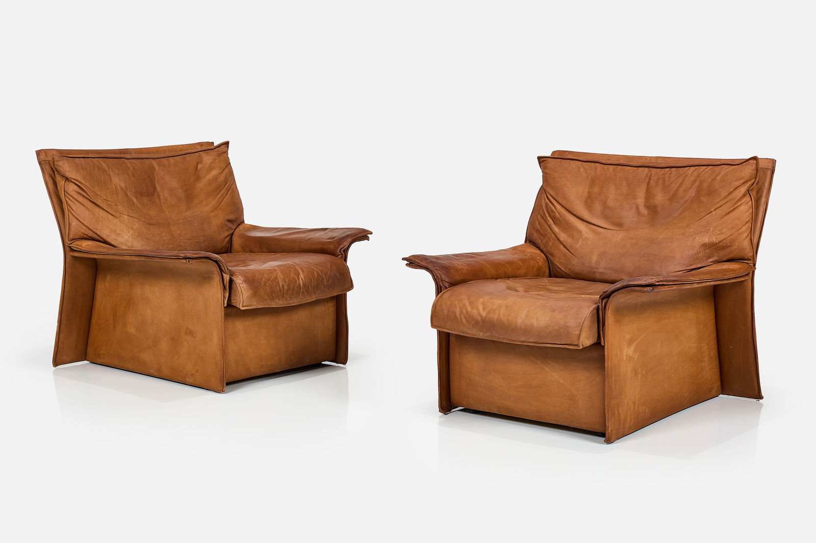 Michael Knoll, 'Wings' Lounge Chairs (2): MICHAEL KNOLLPair of 'Wings' lounge chairs, 1970sLeather. Manufactured by Walter Knoll, Germany.Underside with manufacturer's label. Each: 29.5" H x 32" W x 33" DSeat