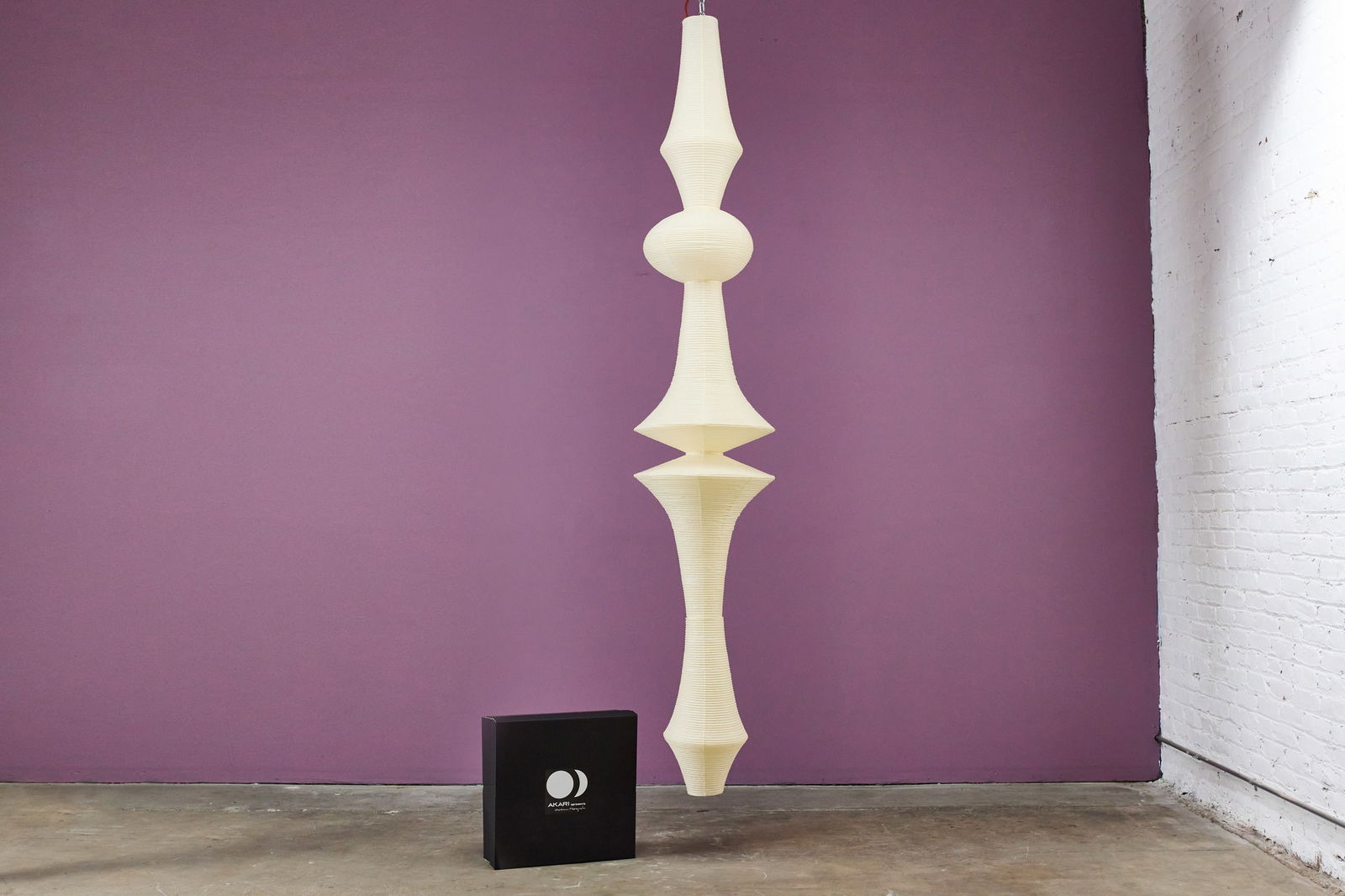 Isamu Noguchi, Hanging 'Akari' Light Sculpture: ISAMU NOGUCHIHanging 'Akari' light sculpture, model E, 2020sMirogami paper, metal. Manufactured by Ozeki, Japan.Stamped signature at bottom of shade.Together with original box. 108