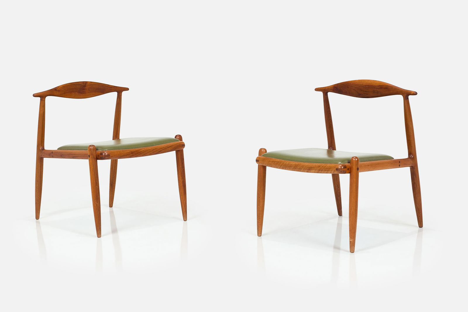 John Nyquist, Lounge Chairs (2): JOHN NYQUISTPair of lounge chairs, ca. 1960Walnut, vinyl. Studio-made, Long Beach, CA.Side of seat incised "JN". Each: 27.75" H x 22" W x 25" DSeat height: 16" &nb