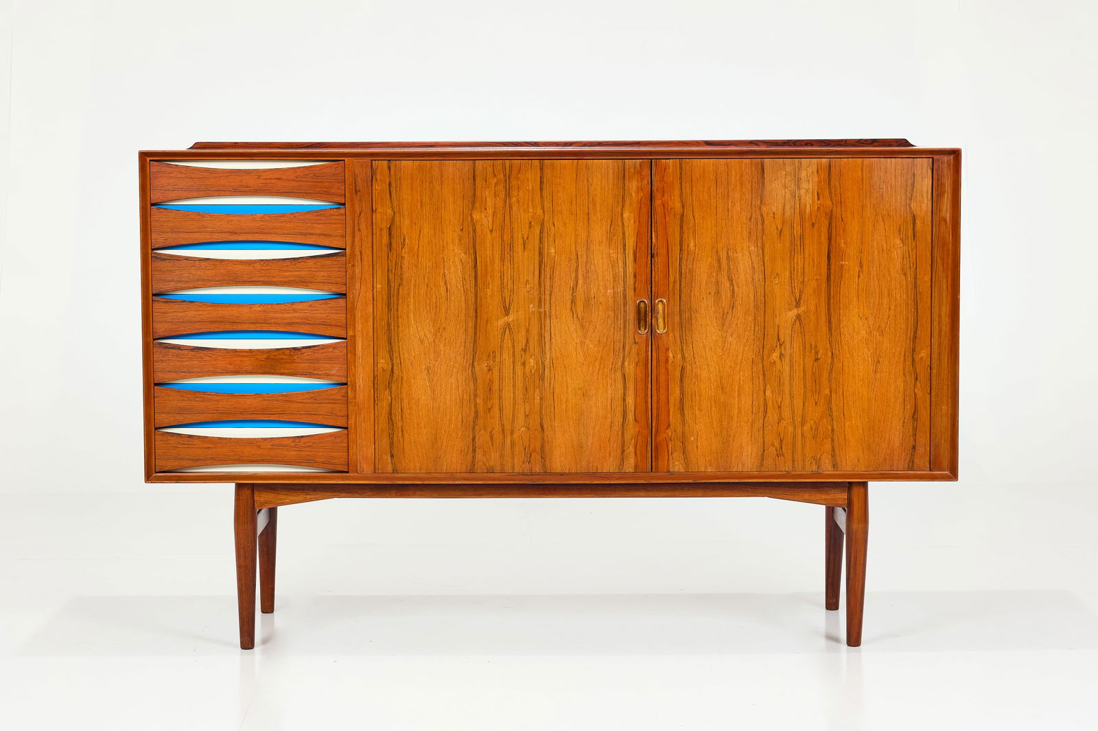 Niels Clausen, Credenza: NIELS CLAUSENCredenza, 1960sRosewood, birch, painted wood. Manufactured by N.C. Mobler, Denmark. 45.25" H x 72" W x 19.5" D