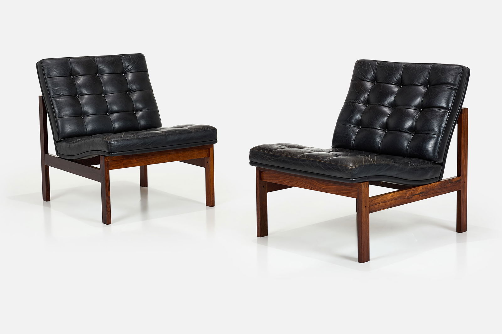 Ole Gjerlov-Knudsen + Torben Lind, Slipper Chairs (2): OLE GJERLOV-KNUDSEN + TORBEN LINDPair of slipper chairs, 1960sLeather, rosewood. Manufactured by France & Son, France / Denmark.Undersides with manufacturer's roundel and impressed "made