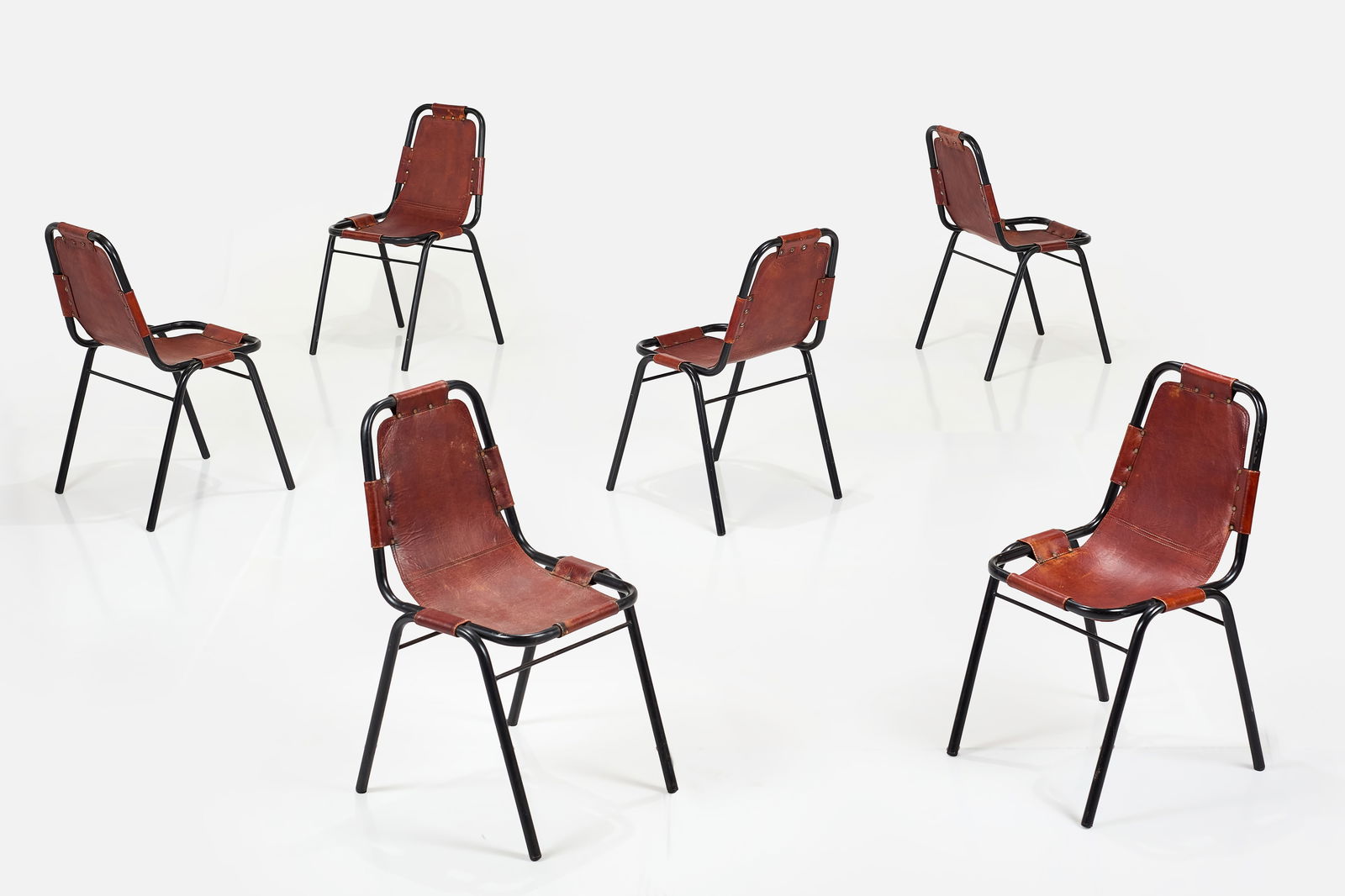 Charlotte Perriand, Dining Chairs, from Les Arcs (6): CHARLOTTE PERRIANDSet of six dining chairs from Les Arcs, Savoie, ca. 1970Leather, painted tubular steel. Made in France. Each: 34" H x 19" W x 18.5" DSeat height: 18.5" &nb