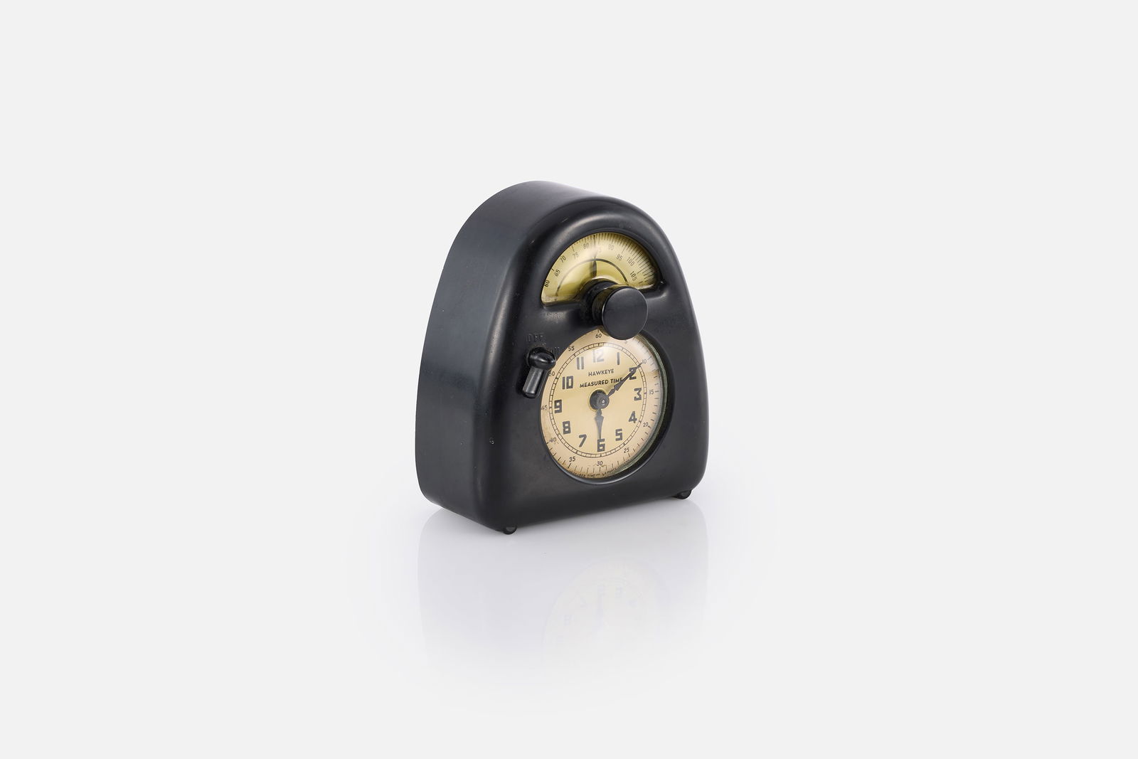 Isamu Noguchi, 'Measured Time' Clock + Kitchen Timer: ISAMU NOGUCHI'Measured Time' clock and kitchen timer, ca. 1932Bakelite, glass, plastic, printed paper. Manufactured by Stevenson Mfg. Co.,USA.Metal manufacturer's tag to reverse "