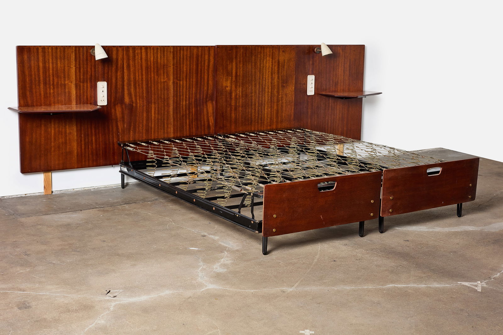 Osvaldo Borsani, Bed with Integrated Headboard: OSVALDO BORSANIBed with integrated headboard, lights and tables, 1950sSapele mahogany, reverse-painted glass, painted aluminum, brass, plastic. Made in Italy. 42.5" H x 130" W x 80&qu